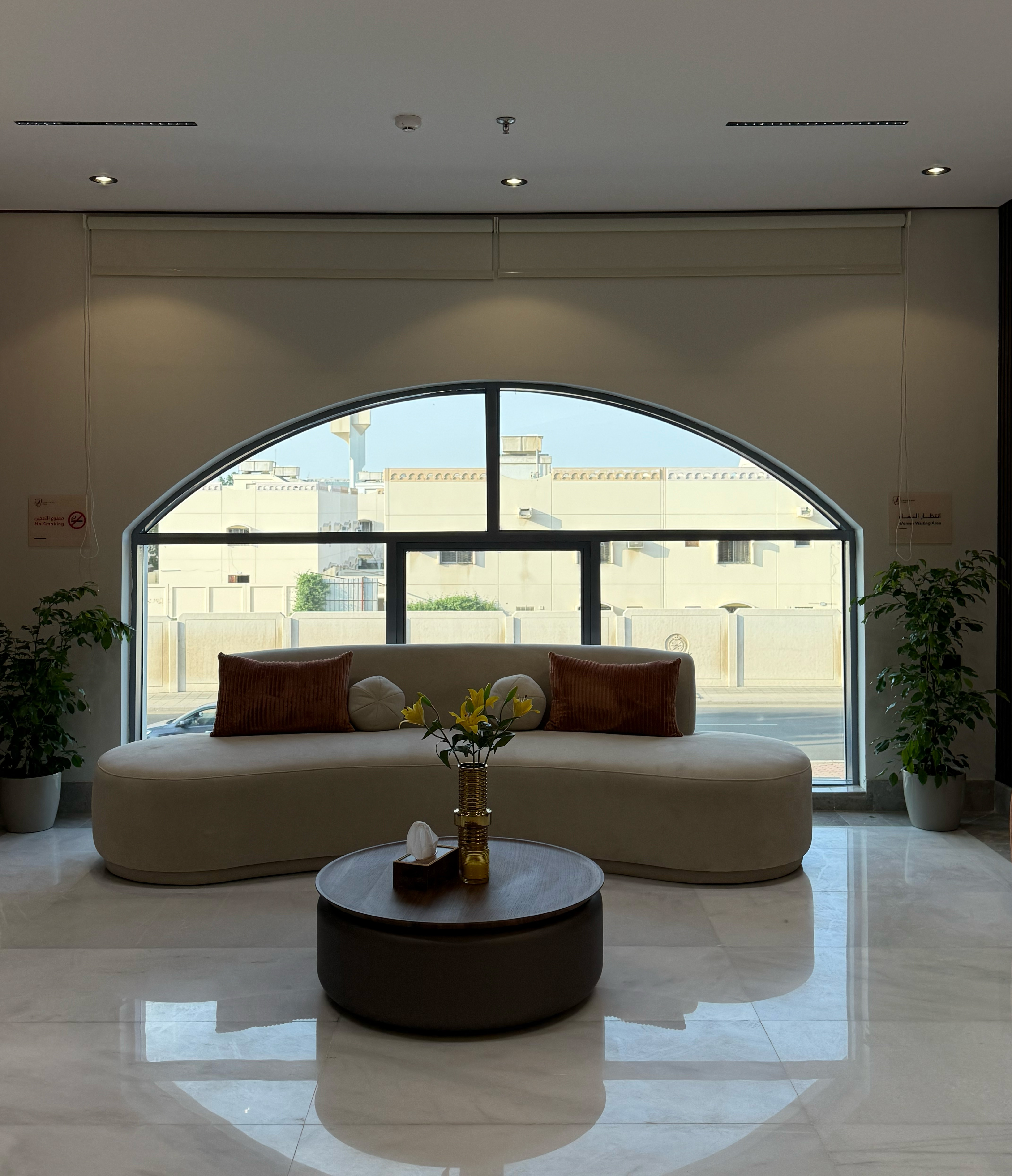 a room with a round table and a couch